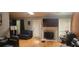 Living room with hardwood floors, fireplace, and plenty of natural light at 764 Avalon Forest Way, Lawrenceville, GA 30044