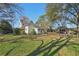 Large backyard with a firepit and outbuildings at 14299 Highway 36, Covington, GA 30014