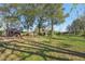 Spacious backyard with large trees and outbuildings at 14299 Highway 36, Covington, GA 30014