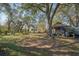 Large backyard with a shed and mature trees at 14299 Highway 36, Covington, GA 30014