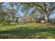 Spacious backyard with large trees, firepit, and shed at 14299 Highway 36, Covington, GA 30014