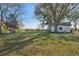 Open backyard with a shed and large trees at 14299 Highway 36, Covington, GA 30014