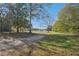 Long driveway leading to a charming house in a rural setting at 14299 Highway 36, Covington, GA 30014