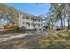 Charming two-story home with wrap-around porch and mature trees at 14299 Highway 36, Covington, GA 30014