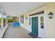 Inviting front porch with tiled floor and green door at 14299 Highway 36, Covington, GA 30014