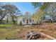 Charming yellow house exterior with a fire pit at 14299 Highway 36, Covington, GA 30014