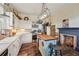 Farmhouse kitchen with butcher block island, stainless steel appliances, and white shaker cabinets at 14299 Highway 36, Covington, GA 30014