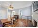 Spacious living room with hardwood floors, fireplace and large windows at 14299 Highway 36, Covington, GA 30014