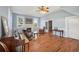 Living room with hardwood floors, fireplace, and a piano at 14299 Highway 36, Covington, GA 30014