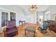 Living room with hardwood floors, fireplace, and ample natural light at 14299 Highway 36, Covington, GA 30014