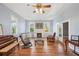 Spacious living room with hardwood floors, fireplace, and seating area at 14299 Highway 36, Covington, GA 30014