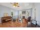 Spacious living room featuring hardwood floors, fireplace, and large windows at 14299 Highway 36, Covington, GA 30014