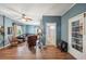 Spacious living room featuring hardwood floors, comfortable seating, and a fireplace at 14299 Highway 36, Covington, GA 30014