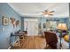 Living room with blue walls, hardwood floors, and a comfortable seating area at 14299 Highway 36, Covington, GA 30014