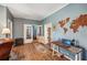 Home office space with wood floors and a world map feature wall at 14299 Highway 36, Covington, GA 30014
