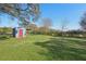 Small storage shed in a grassy backyard at 14299 Highway 36, Covington, GA 30014