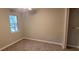 Spacious bedroom with carpet and large window at 2991 Meadowview Ln, Lawrenceville, GA 30044