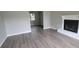 Spacious living room with fireplace and wood-look flooring at 2991 Meadowview Ln, Lawrenceville, GA 30044