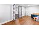 Finished basement area with laminate wood flooring and extra storage at 3741 100 Rd, Douglasville, GA 30135