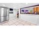 Stainless steel appliances and dark wood cabinets in the basement kitchen at 3741 100 Rd, Douglasville, GA 30135