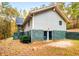 Gray house exterior with stone accents and wooded backyard at 3741 100 Rd, Douglasville, GA 30135