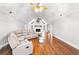 Living room with vaulted ceiling, hardwood floors, and a large sectional sofa at 3741 100 Rd, Douglasville, GA 30135