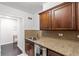 Granite countertops and wood cabinets in this updated kitchen at 300 Peachtree Ne St # 21J, Atlanta, GA 30308