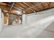 Unfinished basement with white brick walls and a gray concrete floor at 3826 Ensign Dr, Chamblee, GA 30341