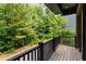 Private balcony overlooking a wooded area at 434 Selborne Way, Chattahoochee Hills, GA 30268