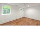 Spacious basement bedroom with hardwood floors and large windows at 434 Selborne Way, Chattahoochee Hills, GA 30268