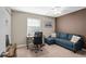 Home office with a desk, chair and comfortable couch at 71 Dunwoody Springs Dr, Atlanta, GA 30328