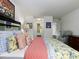 Bedroom with a floral comforter and mirrored headboard, and a view of the bathroom at 75 Fair Haven Se Way, Smyrna, GA 30080