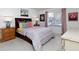 Bedroom featuring a floral comforter and a dresser at 75 Fair Haven Se Way, Smyrna, GA 30080