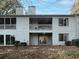 Rear view of the house showing two levels and a patio at 75 Fair Haven Se Way, Smyrna, GA 30080