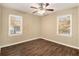 Spacious bedroom with hardwood floors and a ceiling fan at 1425 Cobb Branch Dr, Decatur, GA 30032