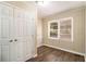 Bright bedroom with hardwood floors and white double doors at 1425 Cobb Branch Dr, Decatur, GA 30032