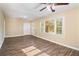 Bright living room with hardwood floors and large windows at 1425 Cobb Branch Dr, Decatur, GA 30032
