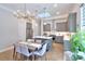 Bright dining area adjacent to a modern kitchen at 679 Stickley Oak Way, Woodstock, GA 30189