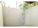 Small enclosed backyard with concrete walls and climbing vine at 1584 Tallulah Nw St, Atlanta, GA 30318