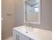 Modern bathroom with white vanity and large mirror at 1584 Tallulah Nw St, Atlanta, GA 30318