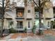 Three-unit townhome building with tree-lined street at 1584 Tallulah Nw St, Atlanta, GA 30318