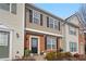 Townhome exterior showcasing a brick and siding facade, landscaping, and multiple units at 1715 Kilmington Ct, Alpharetta, GA 30009