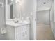 Clean bathroom with white vanity and a framed mirror at 3209 Dover Dr, Duluth, GA 30096