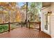 Back deck overlooking wooded area with autumn leaves at 5204 Camden Lake Nw Pkwy, Acworth, GA 30101