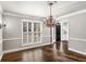 Formal dining room with hardwood floors, chandelier, and wainscoting at 5204 Camden Lake Nw Pkwy, Acworth, GA 30101