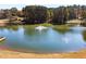 Serene community pond with a central fountain at 5204 Camden Lake Nw Pkwy, Acworth, GA 30101