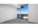Bedroom with grey carpet and large window offering city views at 361 17Th Nw St # 1618, Atlanta, GA 30363