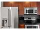 Stainless steel appliances and dark wood cabinetry in kitchen at 361 17Th Nw St # 1618, Atlanta, GA 30363