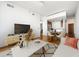 Bright living room with hardwood floors, modern furniture, and dining area at 361 17Th Nw St # 1618, Atlanta, GA 30363