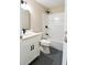 Modern basement bathroom with white vanity and shower/tub combo at 120 Lismore Ct, Tyrone, GA 30290